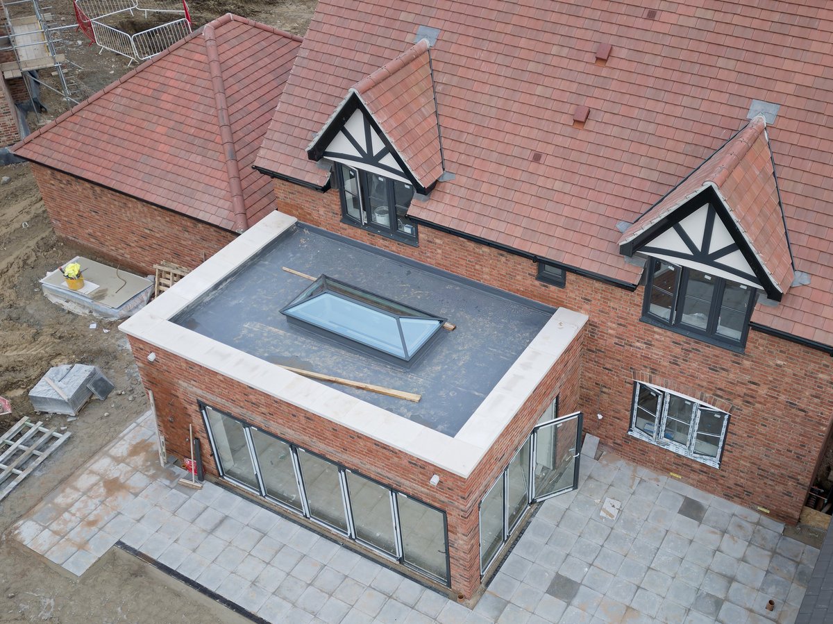 Newly built British family home with a glazed conservatory roof
